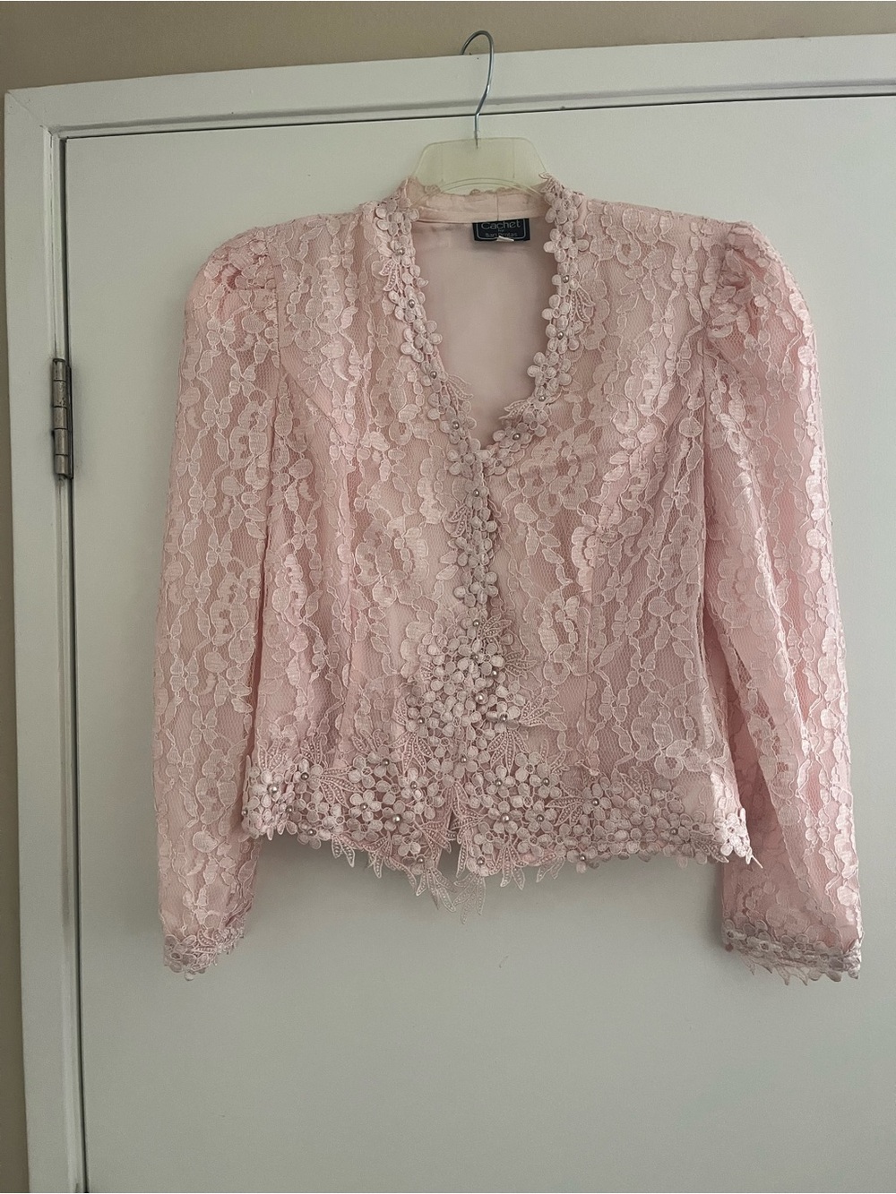 This is a vintage 1980s pink lace cocktail jacket by Cachet by Bari Protas,